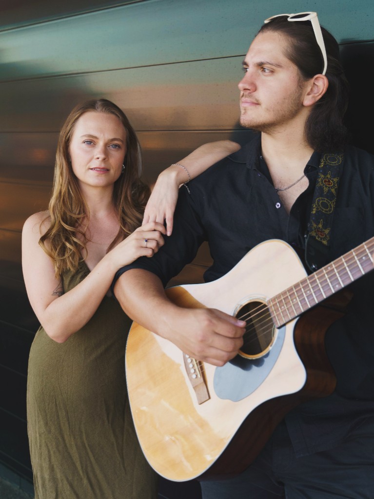 Sammie and Angelo with acoustic guitar